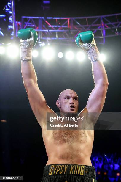 Tyson Fury celebrates his win by TKO in the seventh round against Deontay Wilder in the Heavyweight bout for Wilder's WBC and Fury's lineal...