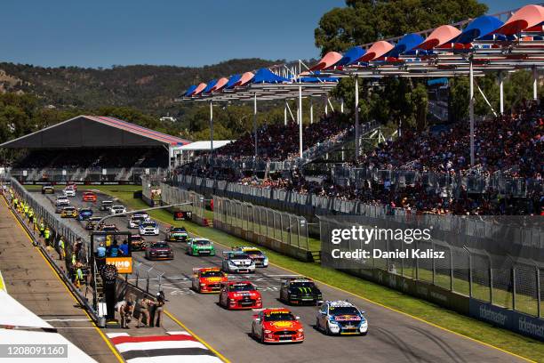 Scott McLaughlin drives the Shell V-Power Racing Team Ford Mustang and Shane van Gisbergen drives the Red Bull Holden Racing Team Holden Commodore ZB...