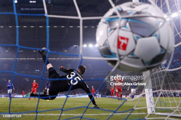 Marcel Sabitzer of Leipzig scores his team's first goal past goalkeeper Alexander Nuebel of Schalke during the Bundesliga match between FC Schalke 04...