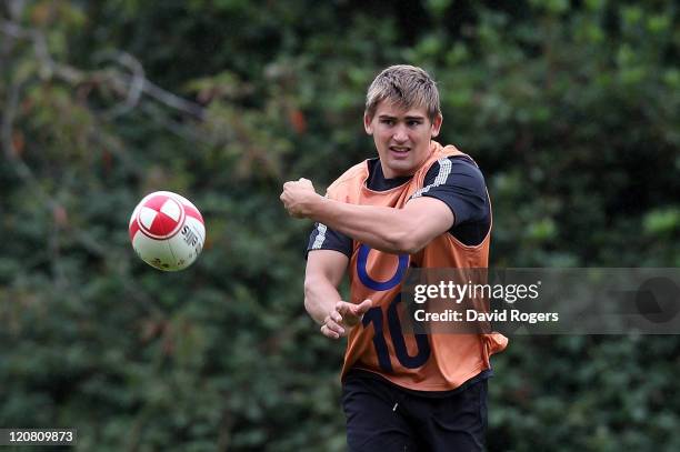 Toby Flood passes the ball during the England training session held at the Pennyhill Park Hotel on August 11, 2011 in Bagshot, England.