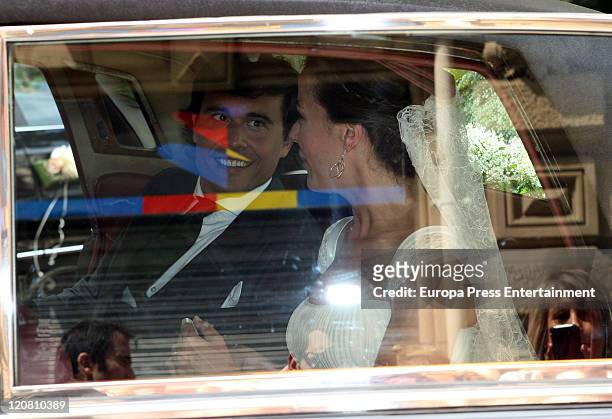 Spanish model Ines Sainz and her husband Christian Martin Perez Carrion sit in a car at their wedding at the San Vicente Abando Chapel on August 10,...