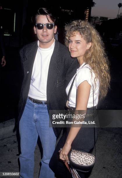 Actor Charlie Sheen and actress Kelly Preston attend the "Road House" Westwood Premiere on May 25, 1989 at Mann Village Theatre in Westwood,...