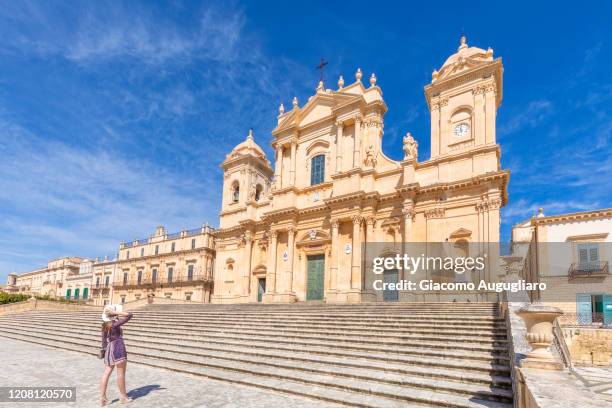 tourist staring at st nicholas cathedral, noto, siracusa province, sicily, italy - syracuse ストックフォトと画像