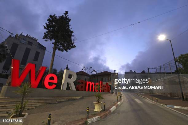 This picture taken on March 24, 2020 shows a view of an empty street in the West Bank city of Ramallah during a two-week ban on all non-essential...