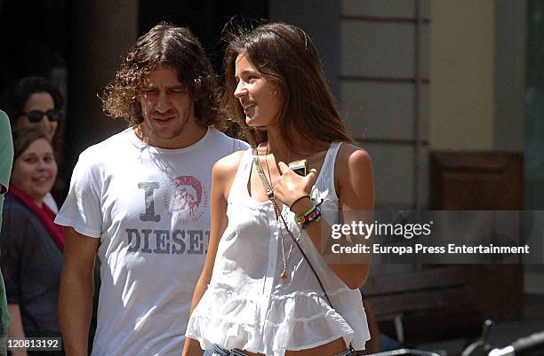 Spanish footballplayer Carles Puyol and his girlfriend spanish model Malena Costa are seen on August 11, 2011 in Barcelona, Spain.