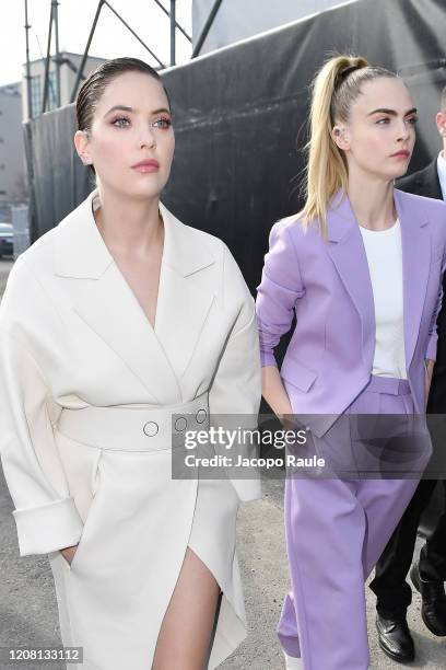 Ashley Benson and Cara Delevingne arrive at the Boss fashion show on February 23, 2020 in Milan, Italy.