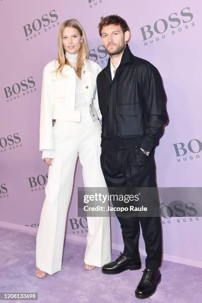 Toni Garrn and Alex Pettyfer attend the Boss fashion show on February 23, 2020 in Milan, Italy.