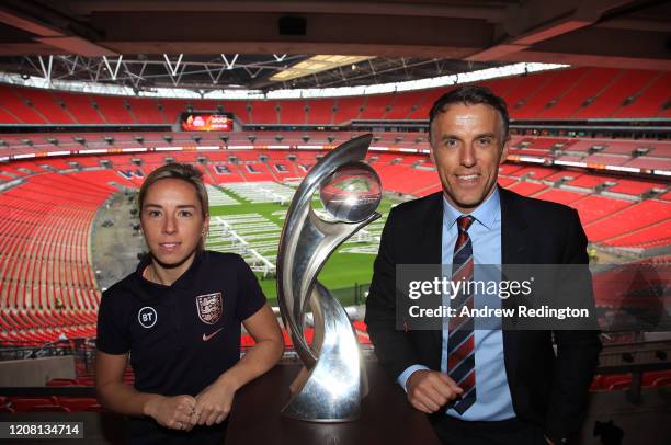 Jordan Nobbs and Phil Neville are pictured with the Championship trophy during the UEFA Women's EURO 2021 500 Days To Go Media Event at Wembley...
