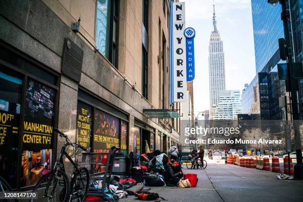 The homeless rest on the street empty of crowds due to the coronavirus on March 24, 2020 in New York City. New York City has about a third of the...