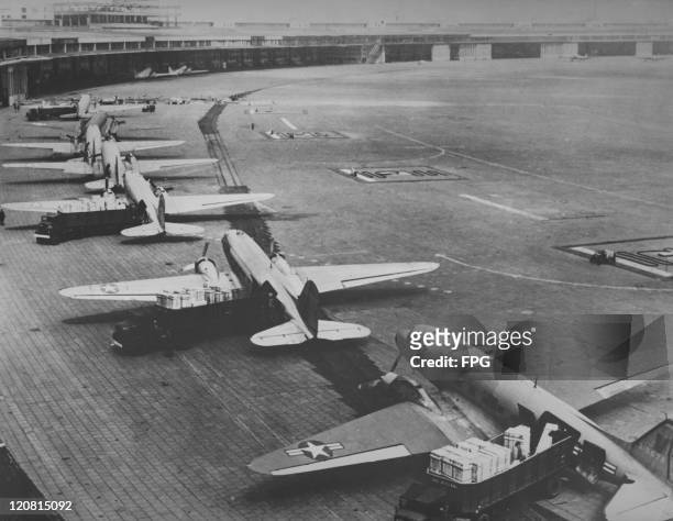 American Air Force Douglas C-47 Skytrain transport aircraft in the unloading line at Tempelhof Airport, during the Berlin Airlift, June 1948