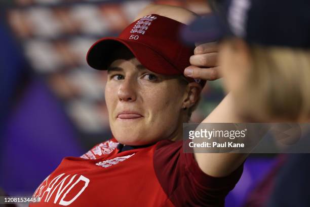 Katherine Brunt of England looks on from the dugout while talking with coach Lisa Keightley during the ICC Women's T20 Cricket World Cup match...