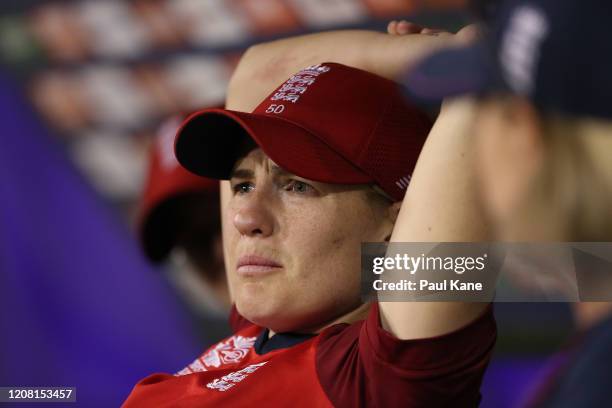 Katherine Brunt of England looks on from the dugout while talking with coach Lisa Keightley during the ICC Women's T20 Cricket World Cup match...