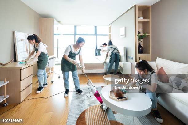 women cleaning house  at multi-tasking - stay at home mother stockfoto's en -beelden