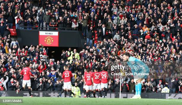 Bruno Fernandes of Manchester United celebrates scoring their first goal during the Premier League match between Manchester United and Watford FC at...