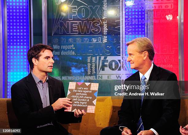 Driver Jeff Gordon and Steve Doocy talk on "FOX & Friends" at FOX Studios on August 11, 2011 in New York City.