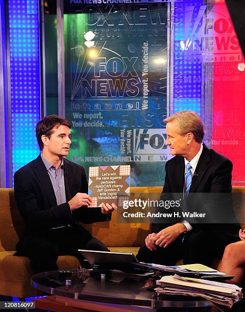 Driver Jeff Gordon and Steve Doocy talk on "FOX & Friends" at FOX Studios on August 11, 2011 in New York City.