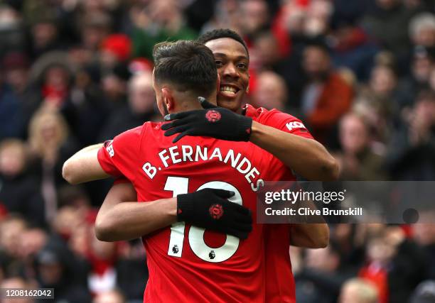 Anthony Martial of Manchester United celebrates after scoring his team's second goal with teammate Bruno Fernandes during the Premier League match...