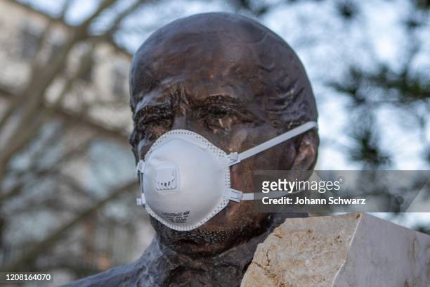 Feature, Statue of Ignaz Semmelweis with protective mask by Coronavirus Affects Everyday Life In Austria at AKH Wien on March 24, 2020 in Vienna,...