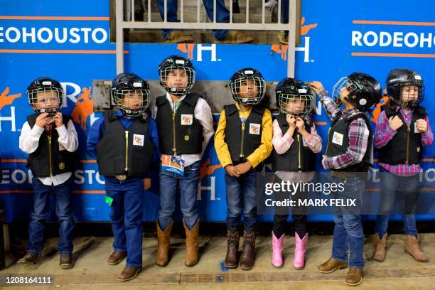 Mutton Bustin' participants wait in line before having their turn to ride during the Houston Livestock Show and Rodeo on March 6, 2020 in Houston,...