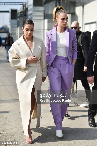Ashley Benson and Cara Delecingne attend the Boss fashion show on February 23, 2020 in Milan, Italy.