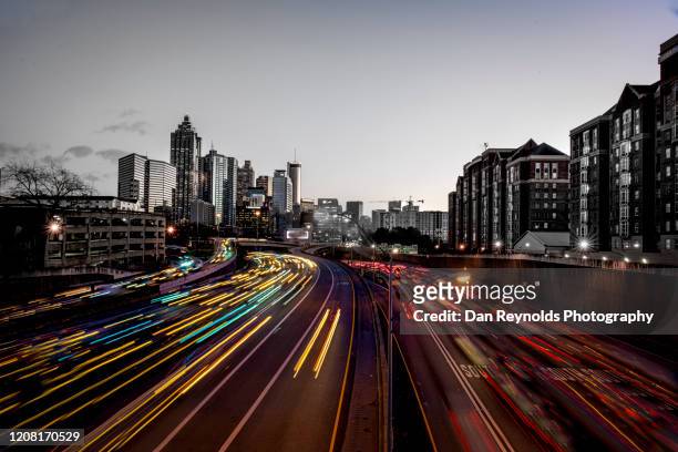 city at sunset - atlanta traffic stock pictures, royalty-free photos & images