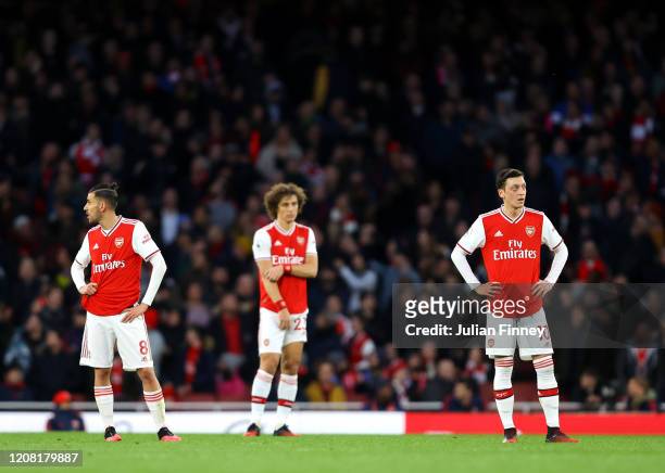 Mesut Ozil of Arsenal looks dejected after Richarlison of Everton scores his team's second goal during the Premier League match between Arsenal FC...