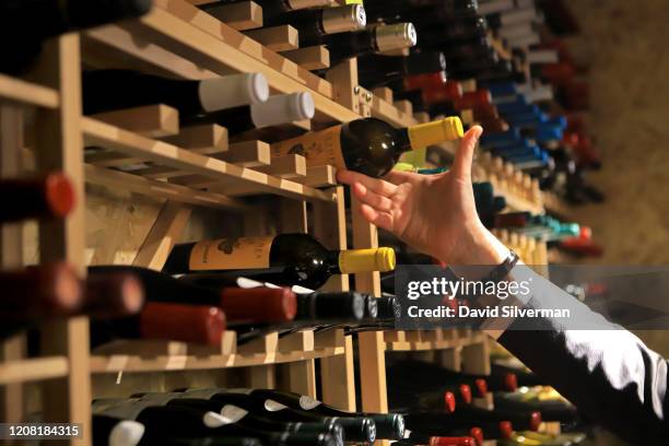 January 30: Adar Bershadsky, head of wine and sommelier at The Jaffa Hotel, selects a bottle of wine from the wine cellar at the hotel's Don Camillo...