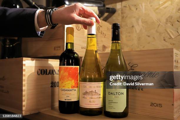 January 30: Adar Bershadsky, head of wine and sommelier at The Jaffa Hotel, displays a trio of the cheapest wines on the menu, Bibi Graetz's Italian...