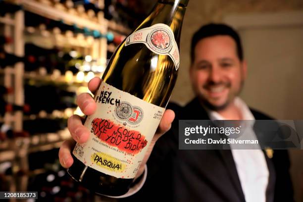 January 30: Adar Bershadsky, head of wine and sommelier at The Jaffa Hotel, holds a bottle of Italian Pasqua winery's multi-vintage Hey French You...