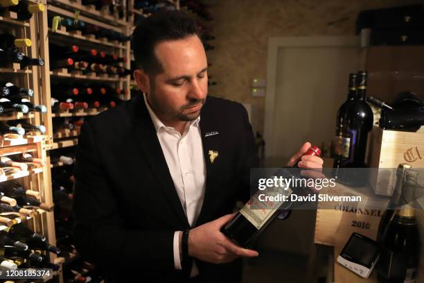 January 30: Adar Bershadsky, head of wine and sommelier at The Jaffa Hotel, holds a bottle of French Bordeaux wine Château Pétrus 2005, the most...