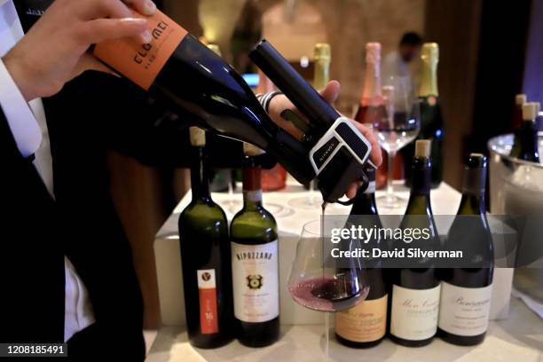 January 30: Adar Bershadsky, head of wine and sommelier at The Jaffa Hotel, uses a Coravin wine extractor to pour a glass of red wine served by the...