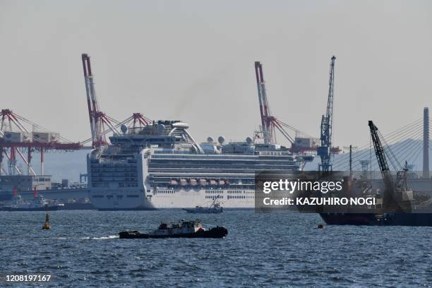 The Diamond Princess cruise ship is seen at a pier in the port of Yokohama on March 25, 2020. - Last month, the cruise ship Diamond Princess was...