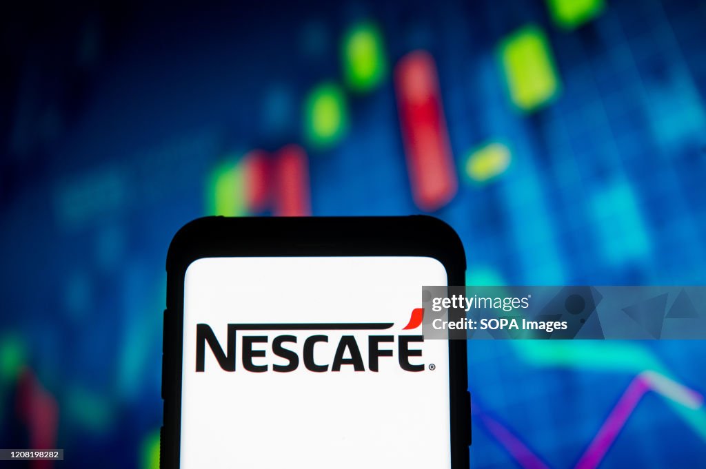 In this photo illustration a Nescafe logo seen displayed on