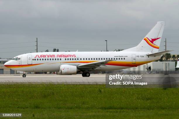 Surinam Airways Boeing 737-300 prepares to depart Miami International airport.