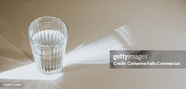 glass of water - grooved stock-fotos und bilder
