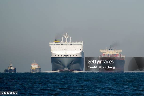 Cargo ships sail into the Port of Rotterdam in Rotterdam, Netherlands, on Tuesday, March. 24, 2020. The spread of coronavirus is scrambling supply...