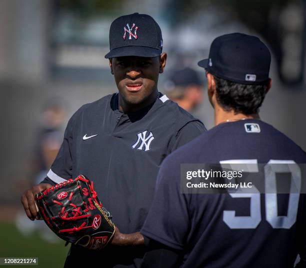 New York Yankees pitcher Luis Severino conversing with first base coach Reggie Willits during spring training in Tampa, Florida on Tuesday Feb. 18,...