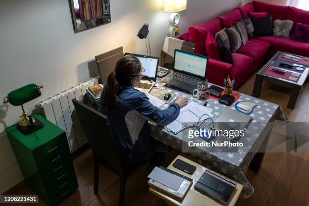 Young woman teleworking from her home during the government-mandated quarantine of the coronavirus in Santander