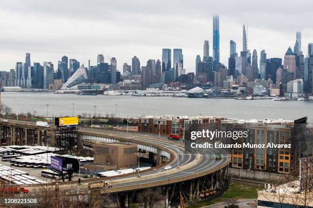 The skyline of New York City is seen as people commute between New Jersey and New York on March 25, 2020 in Weehawkeen, New Jersey. Across the...