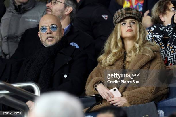 Singer Pascal Obispo and his girlfriend nd Julie Hantson are seen during the Ligue 1 match between Paris Saint-Germain and Girondins Bordeaux at Parc...