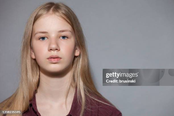 studio portrait of a teenager girl on a gray background - 14 15 stock pictures, royalty-free photos & images