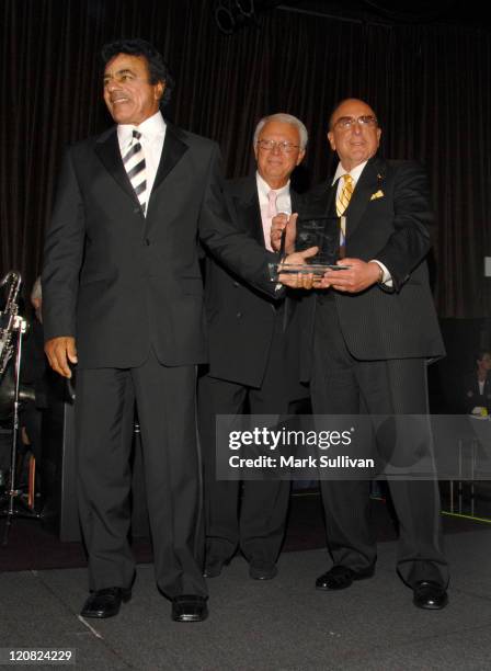 Johnny Mathis receives the 15th Annual Ella Award from Jerry F. Sharell and Clive Davis