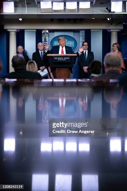 President Donald Trump, joined by members of the Coronavirus Task Force, speaks during a briefing on the coronavirus pandemic, in the press briefing...
