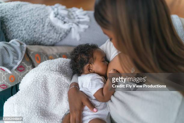 breastfeeding baby - nurse with baby stock pictures, royalty-free photos & images