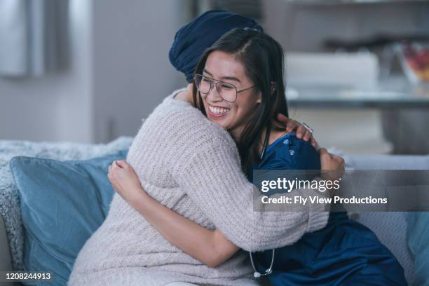 nurse embracing patient - philippines friends stock pictures, royalty-free photos & images