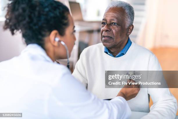 senior adult man at medical appointment - heart and lungs stock pictures, royalty-free photos & images