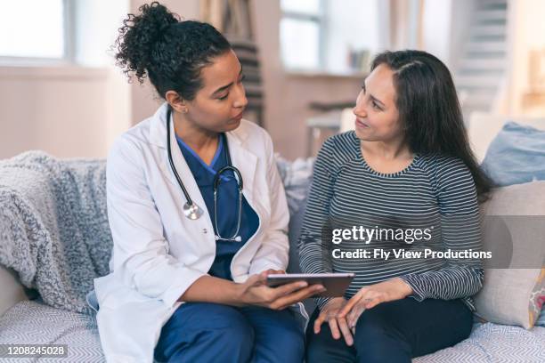 doctor meeting with pregnant woman - patient-journey stock pictures, royalty-free photos & images