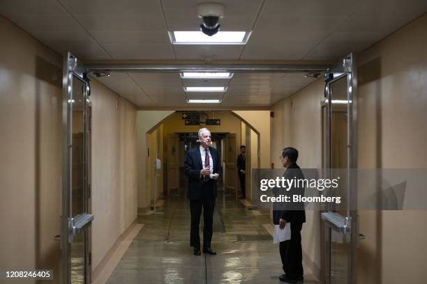 Senator Jerry Moran, a Republican from Kansas, lefty, speaks with a member of the media as he arrives for a vote at the U.S. Capitol in Washington,...
