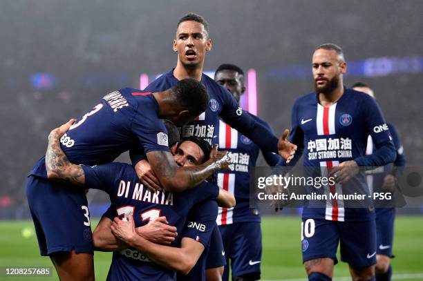 Edinson Cavani of Paris Saint-Germain is congratulated by teammates Thilo Kehrer and Presnel Kimpembe after scoring his 200th goal during the Ligue 1...