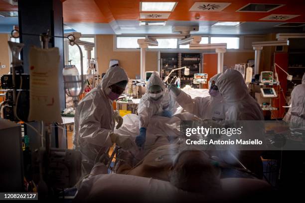 Doctors treat COVID-19 patients in an intensive care unit at the third Covid 3 Hospital during the Coronavirus emergency on March 26 in Rome, Italy....